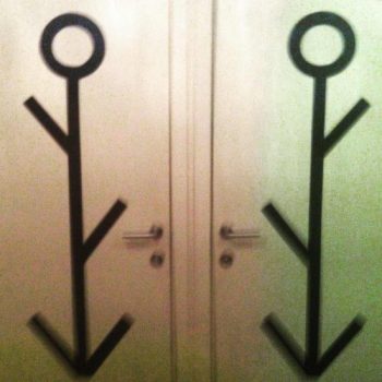Unisex gender bathroom door sign giving off confusing vibes