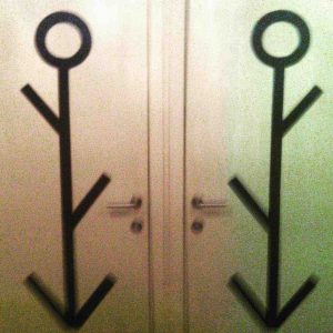 Unisex gender bathroom door sign giving off confusing vibes